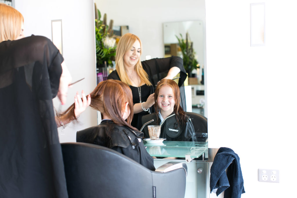 Pixie Curtis Doing a little Girl's Hair